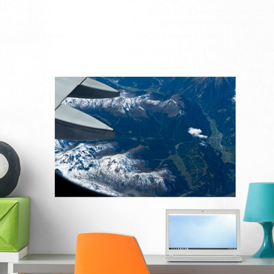 From Plane Alps Wall Mural shown on a wall