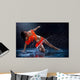 Woman dancing under rain in orange dress. Studio Wall Mural