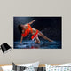 Woman dancing under rain in orange dress. Studio Wall Mural