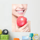 young woman eating red apple with health teeth Wall Mural