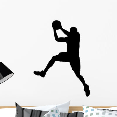 Basketball Player with Ball shown on a wall