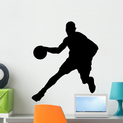 Basketball Player with Ball shown on a wall