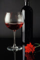 wine glass, bottle and red rose Wall Mural