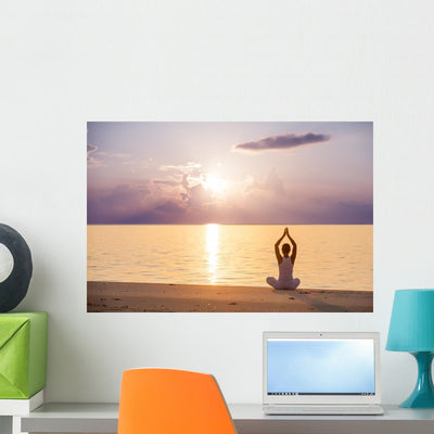 Caucasian Woman Practicing Yoga shown on a wall
