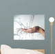 human hands with water splashing on them Wall Mural