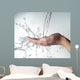 human hands with water splashing on them Wall Mural