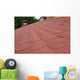 Red asphalt shingle roofing on a roof and chimney Wall Mural