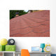 Red asphalt shingle roofing on a roof and chimney Wall Mural