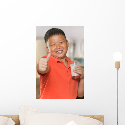 Young Asian Boy with Wall Mural