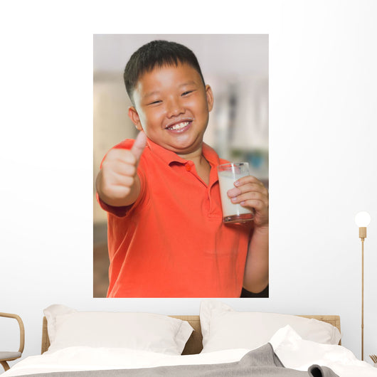 Young Asian Boy with Wall Mural
