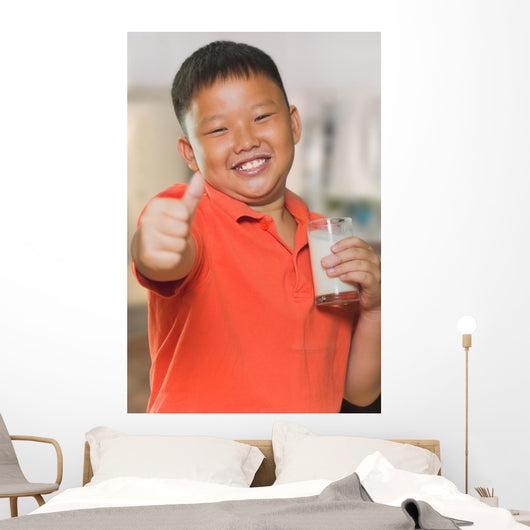 Young Asian Boy with Wall Mural