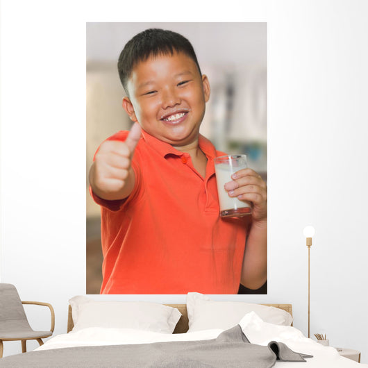 Young Asian Boy with Wall Mural