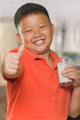 Young Asian Boy with Wall Mural