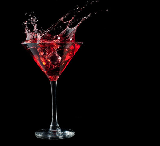 Red Cocktail Splashing Into Glass on Black Wall Mural