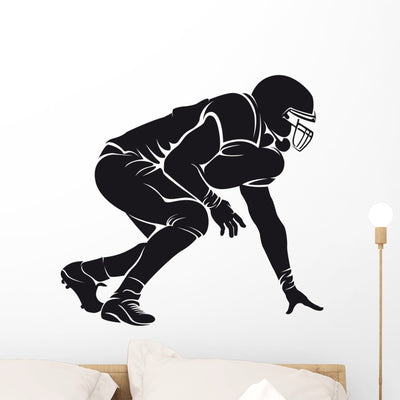 American Football Player Silhouette shown on a wall