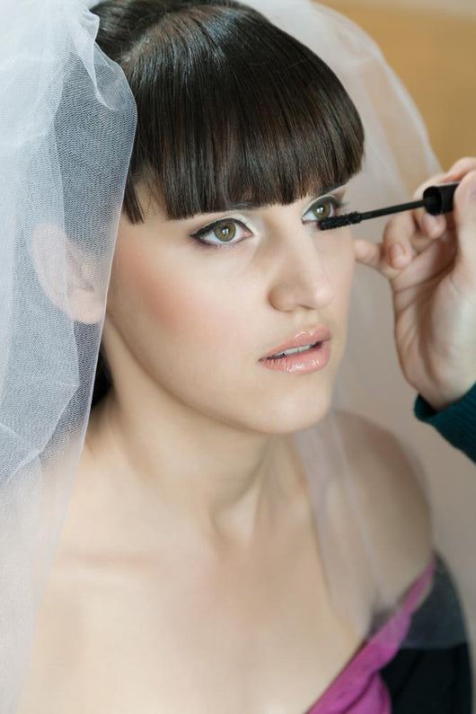 Makeup Artist Applying Eyelashes Wall Mural