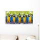 macaws sitting on log. Wall Mural