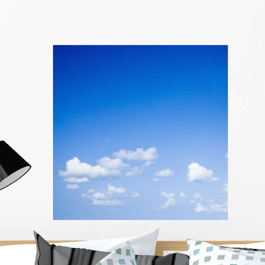 Blue sky with some white puffy clouds. Wall Decal
