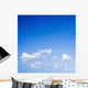 Blue sky with some white puffy clouds. Wall Decal