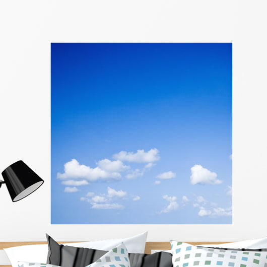 Blue sky with some white puffy clouds. Wall Decal