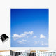 Blue sky with some white puffy clouds. Wall Decal