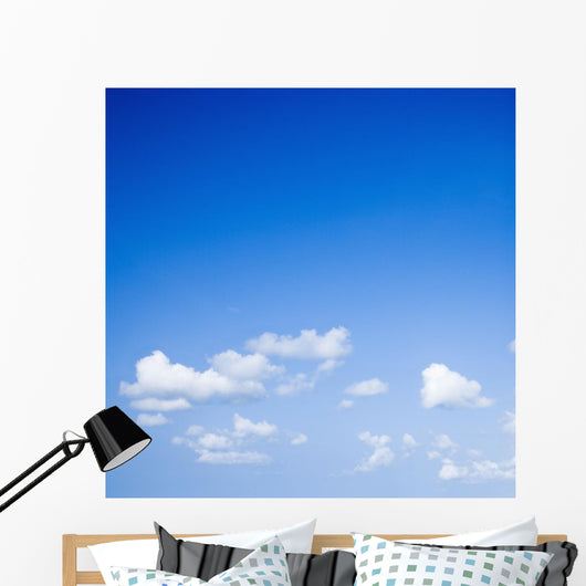 Blue sky with some white puffy clouds. Wall Decal