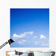 Blue sky with some white puffy clouds. Wall Decal