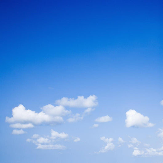 Blue sky with some white puffy clouds. Wall Decal