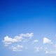 Blue sky with some white puffy clouds. Wall Decal