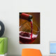 Wine pours into the glass of the bottle Wall Mural
