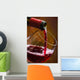 Wine pours into the glass of the bottle Wall Mural