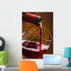 Wine pours into the glass of the bottle Wall Mural