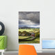 Grass fields and autumn coloured trees under storm clouds Wall Mural