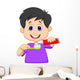 Kid squeezing tooth paste on a toothbrush Wall Decal