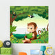 A monkey reading a book at the forest Wall Decal