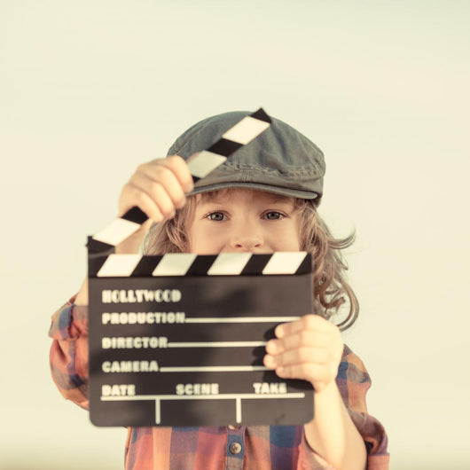 Kid Holding Clapper Board