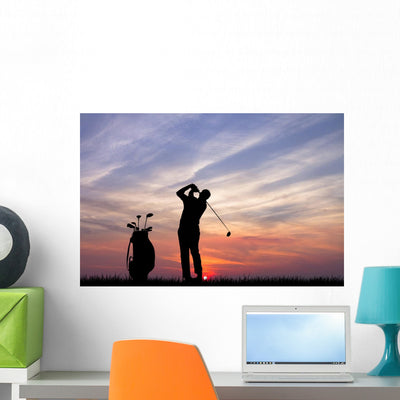 Golfer Sunset Wall Mural shown on a wall