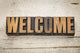 welcome word in wood type Wall Mural