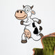 Vector illustration of a running cow cartoon Wall Decal