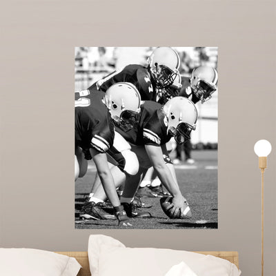 Amerian Football Offensive Linemen shown on a wall