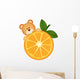 Teddy bear eating orange slice Wall Decal