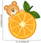 Teddy bear eating orange slice Wall Decal