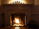 Fireplace With Burning Logs and Candles Wall Mural