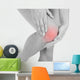 Woman having leg injury Wall Mural