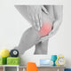 Woman having leg injury Wall Mural