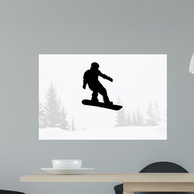 Snowboarder Silhouette shown on a wall