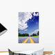 Country-road under a dramatically lighted cloudy sky Wall Mural