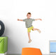 little boy in striped T-shirt dancing. Wall Decal