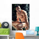 Muscular Wet Bodybuilder Sitting on Railing Wall Mural