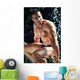 Muscular Wet Bodybuilder Sitting on Railing Wall Mural